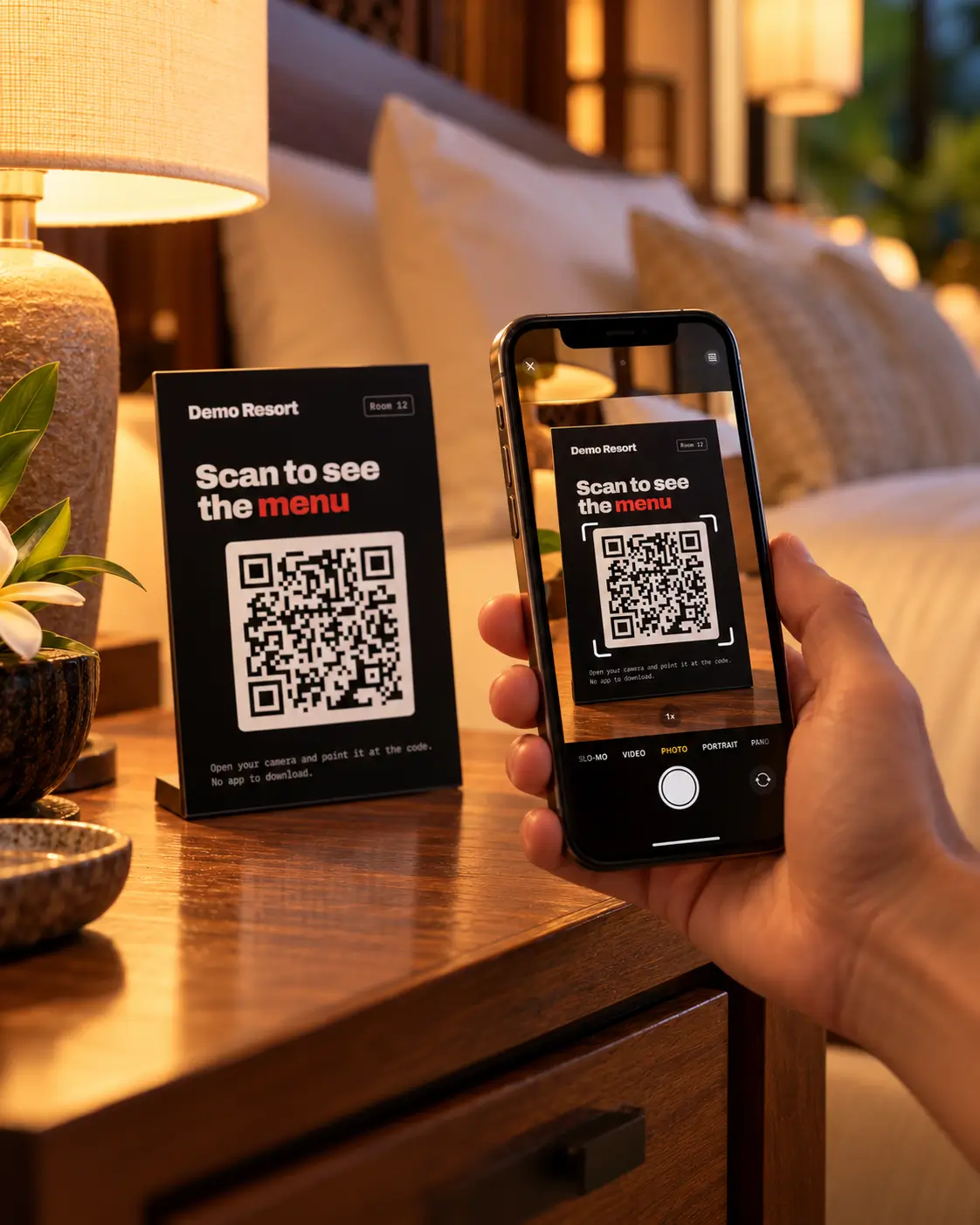 A guest scanning the QR table card on a hotel bedside table with their phone